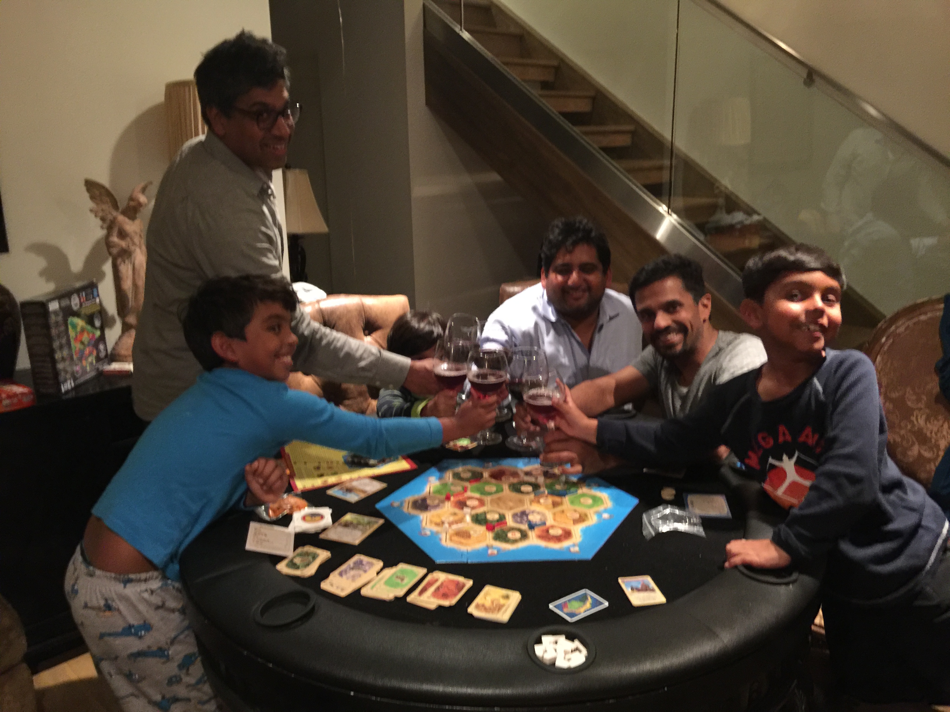 Karan playing Catan with his Dad and friends